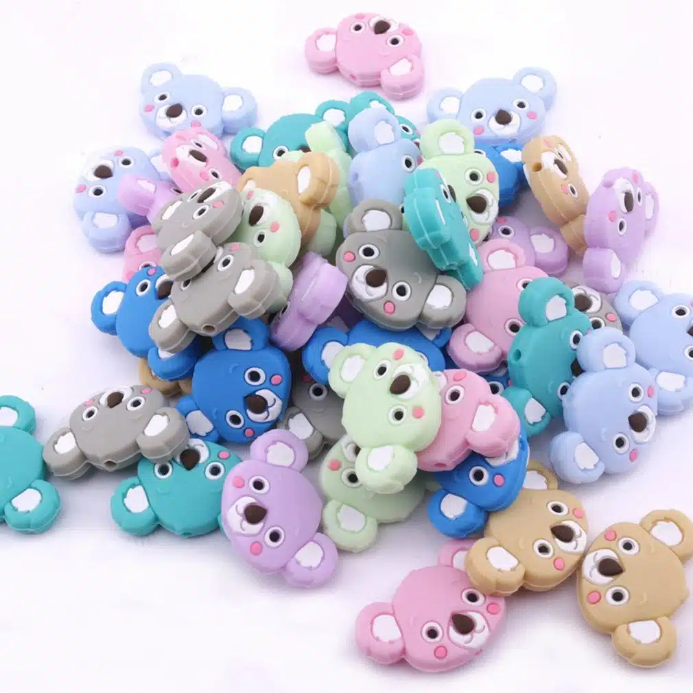 Motivperler formet som koalahode i ulike farger